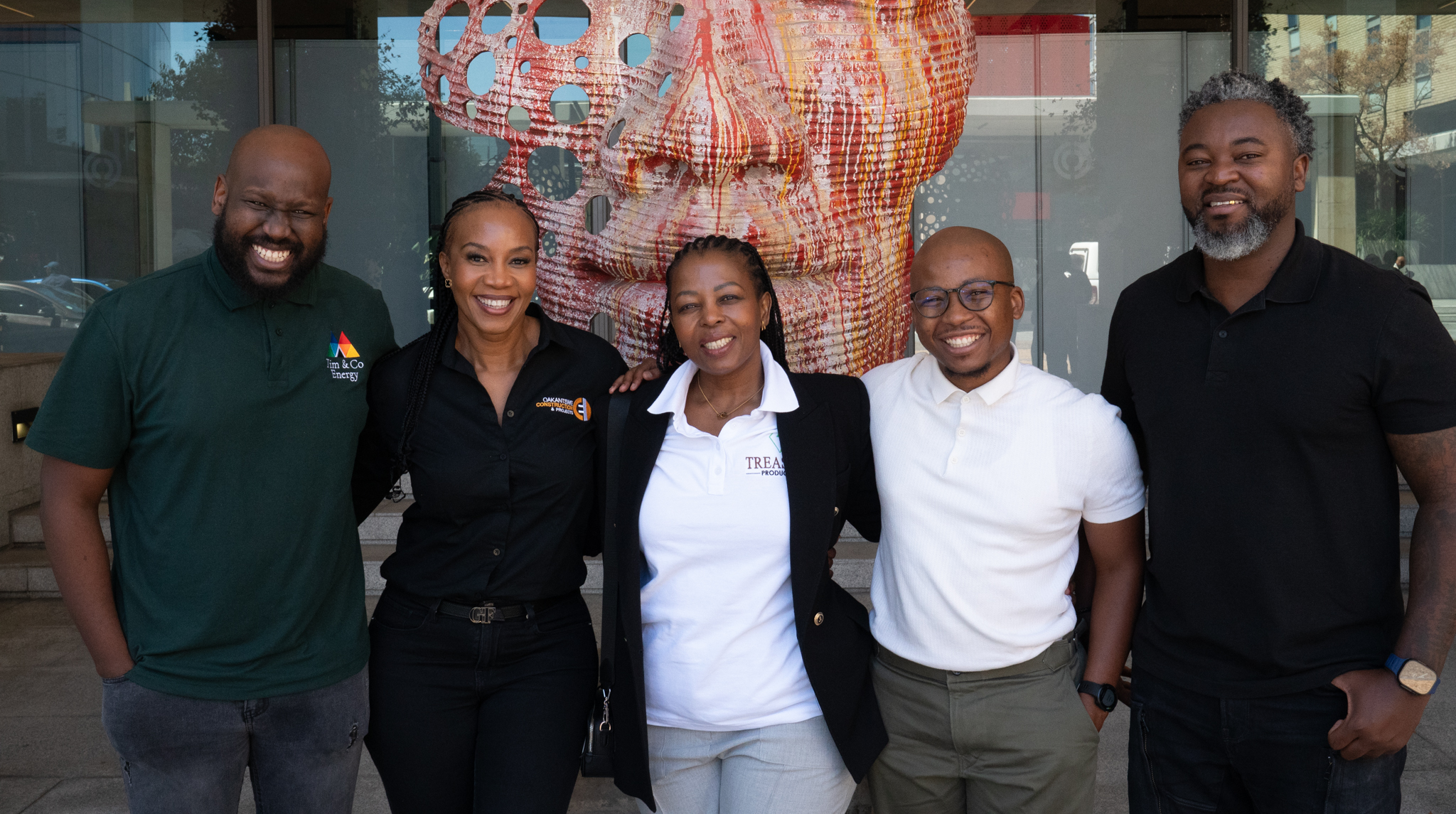 Walnut desk organizer set with white modular trays, next to porcelain mug on wooden desk.