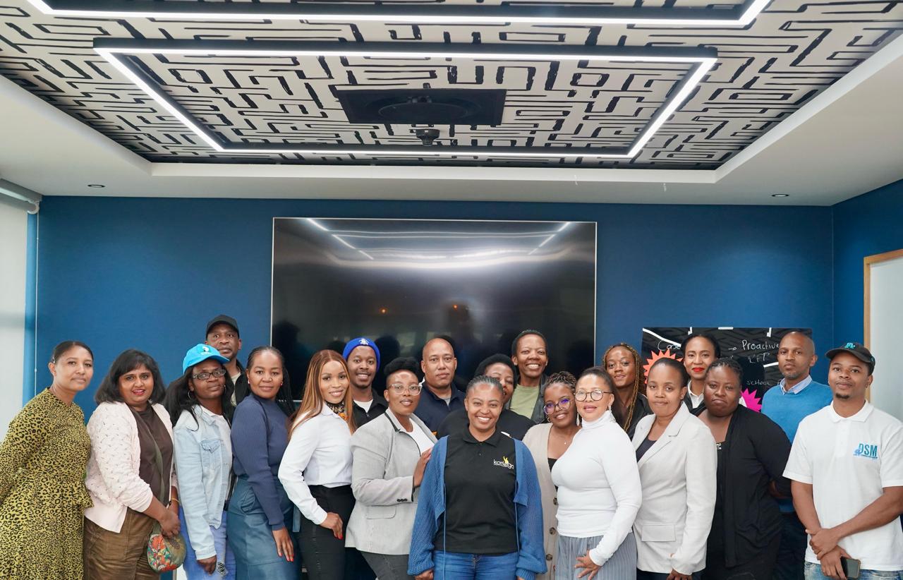 Walnut desk organizer set with white modular trays, next to porcelain mug on wooden desk.
